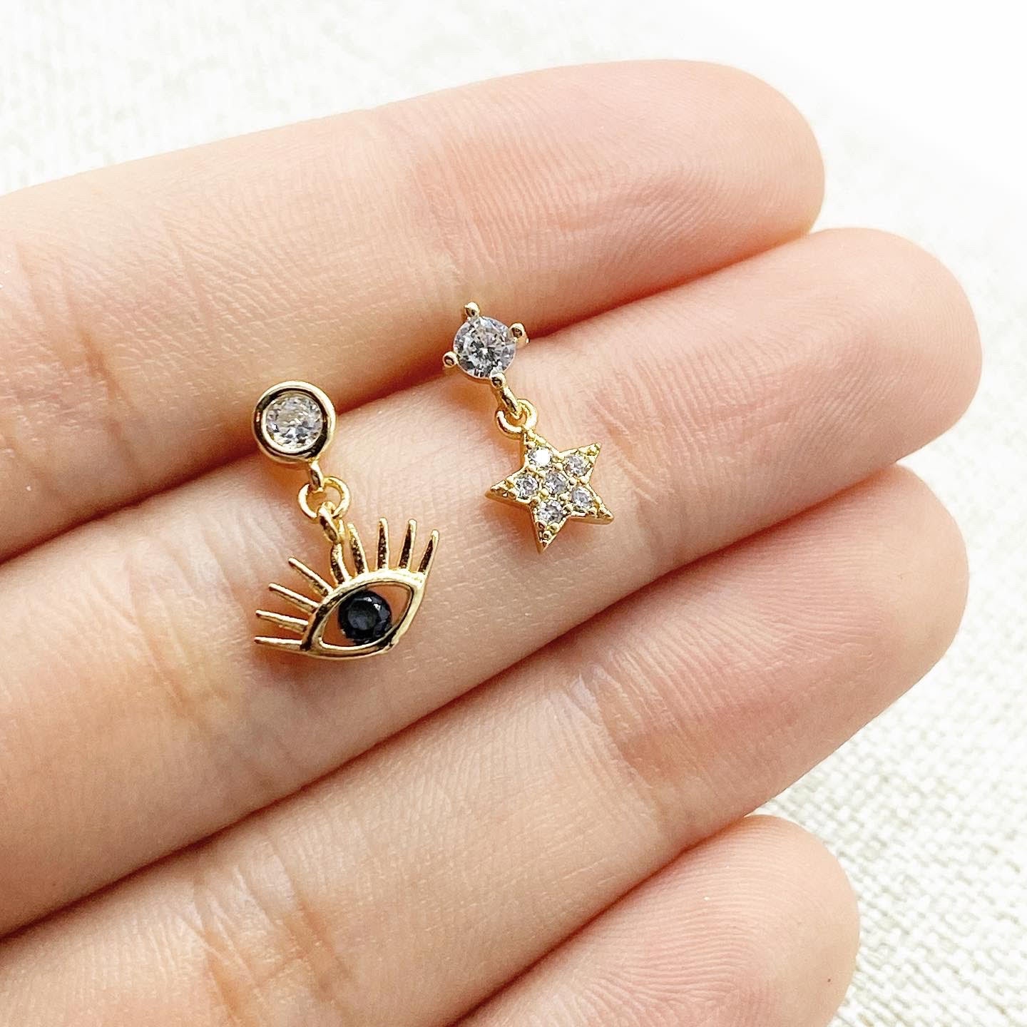 Aretes asimétricos ojo + estrella